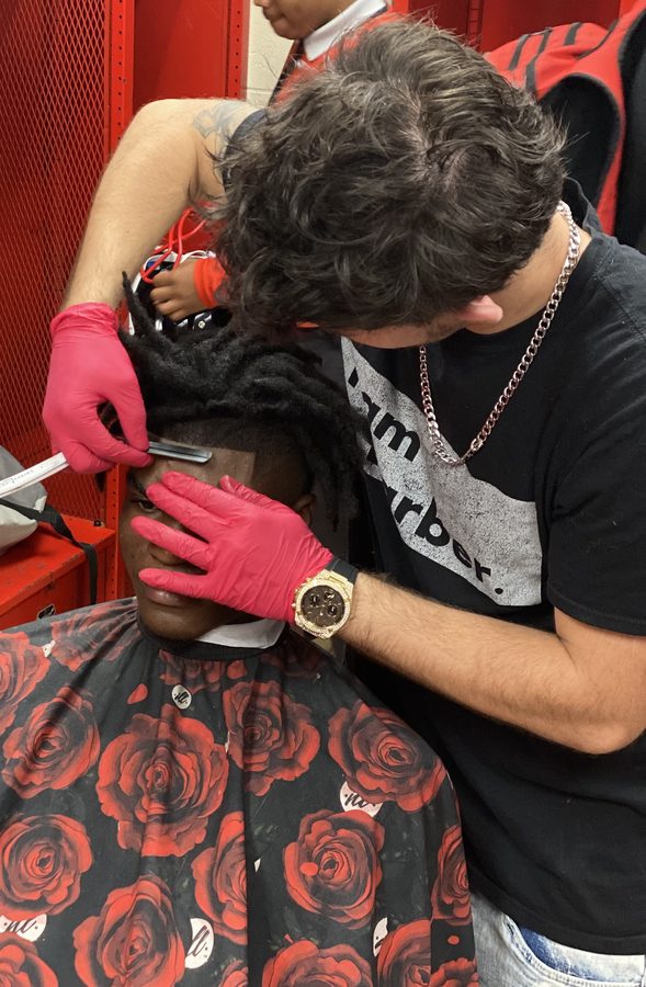 Shaun Fade with clients at the shop